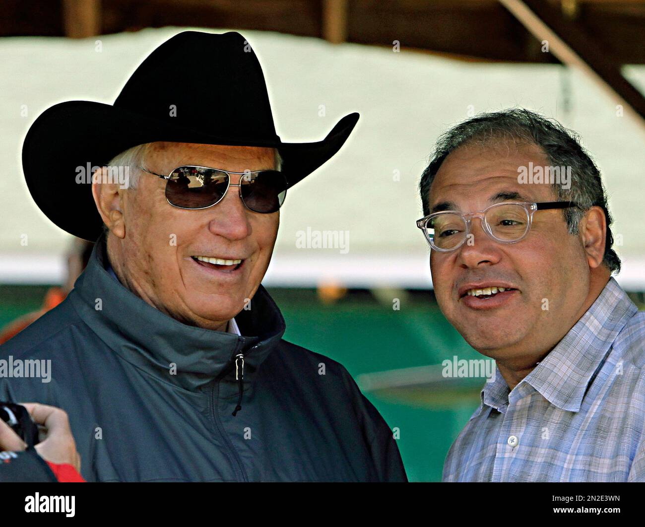 Thoroughbred owner and breeder Ahmed Zayat, right, talks with Hall of