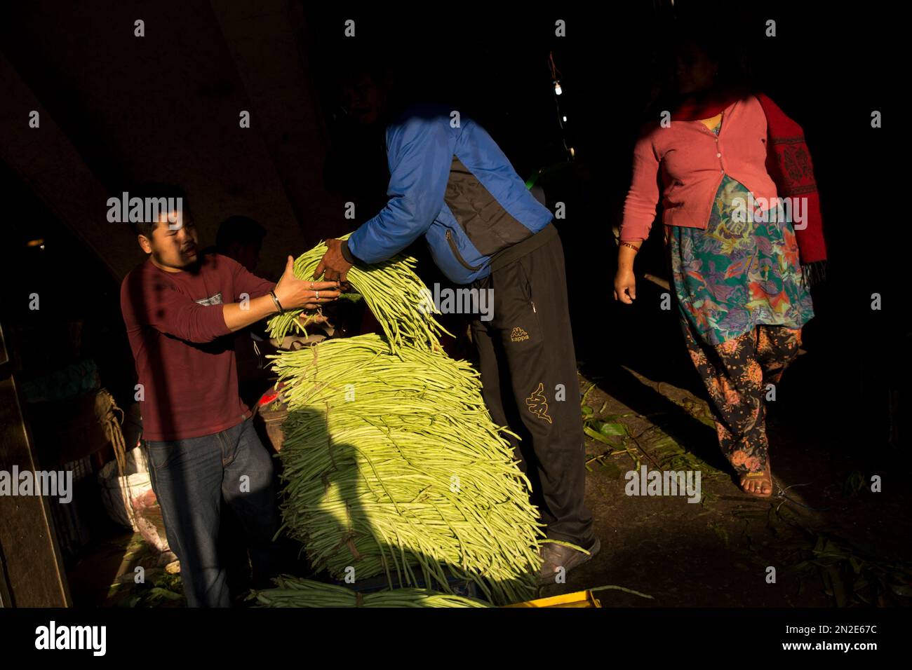 Nepalese residents buy fresh produce at a vegetable market early morning in  Kathmandu, Nepal, Wednesday, April 29, 2015. While many villages across  Nepal affected by Saturday's earthquake are still waiting for rescue