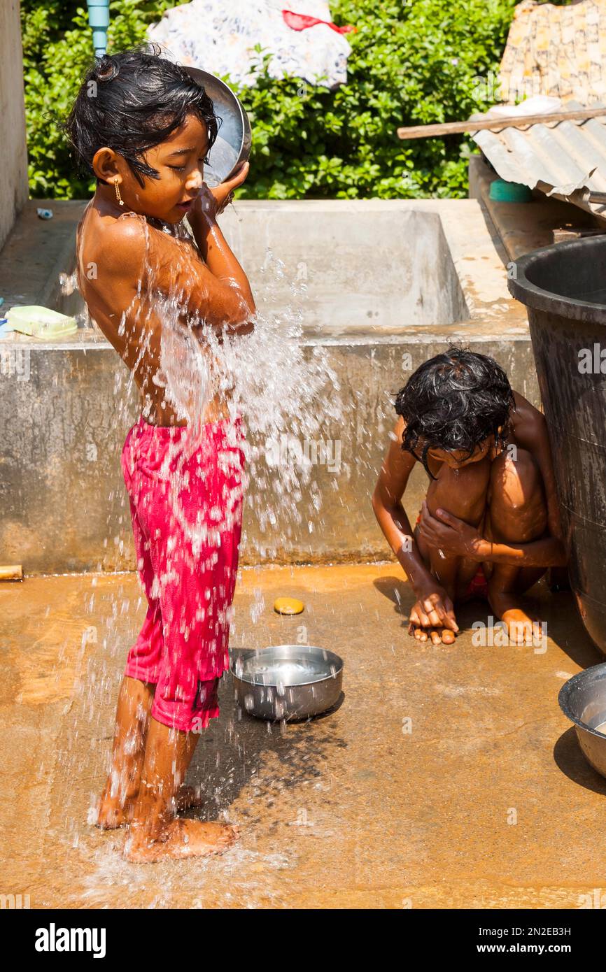 kids girl shower Children shower, Myanmar, Myanmar Stock Photo - Alamy