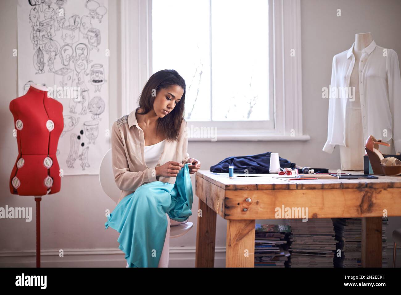 Young tailor working textile hi-res stock photography and images - Alamy