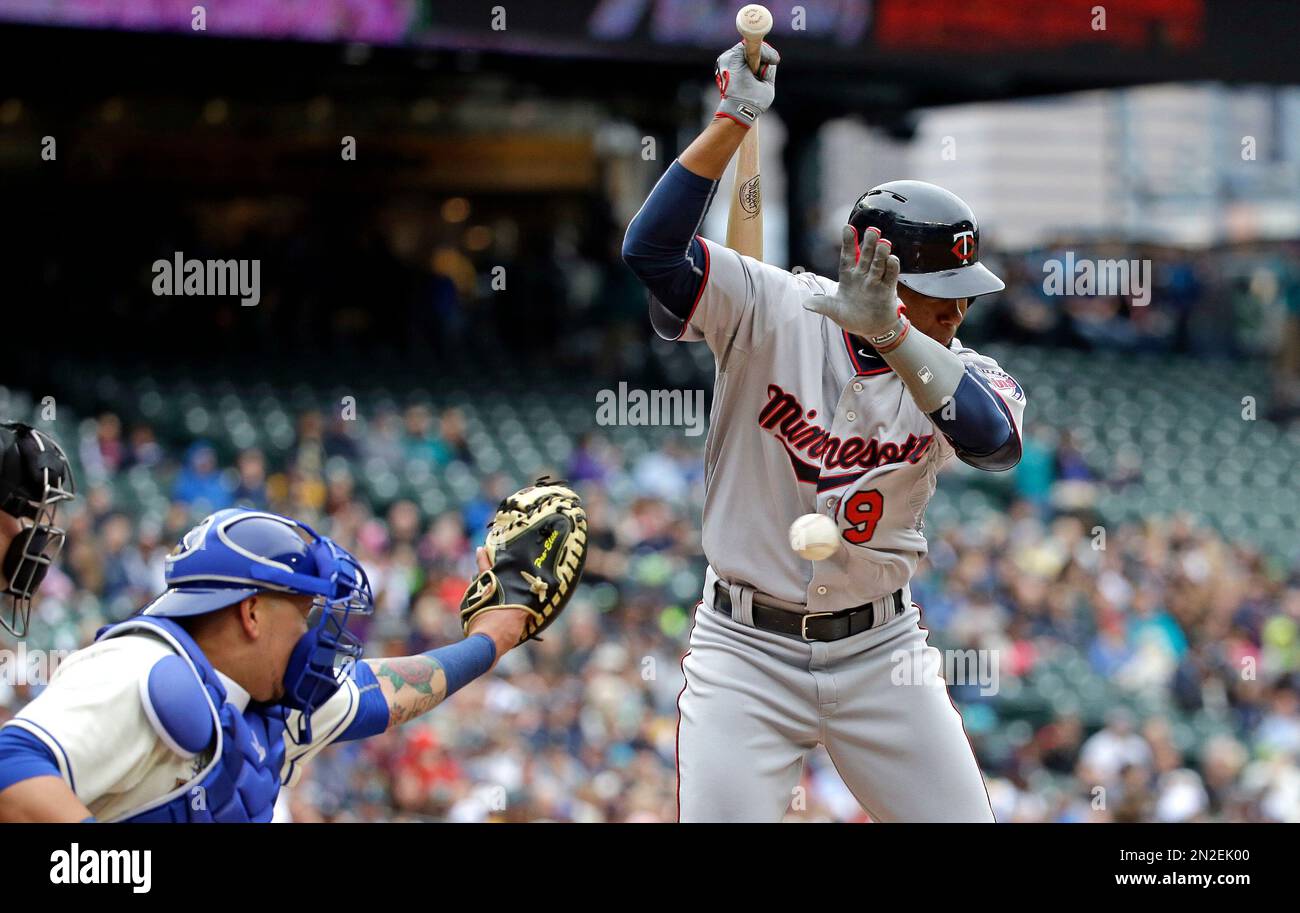 The ball catches the jersey of Minnesota Twins' Danny Santana as he is
