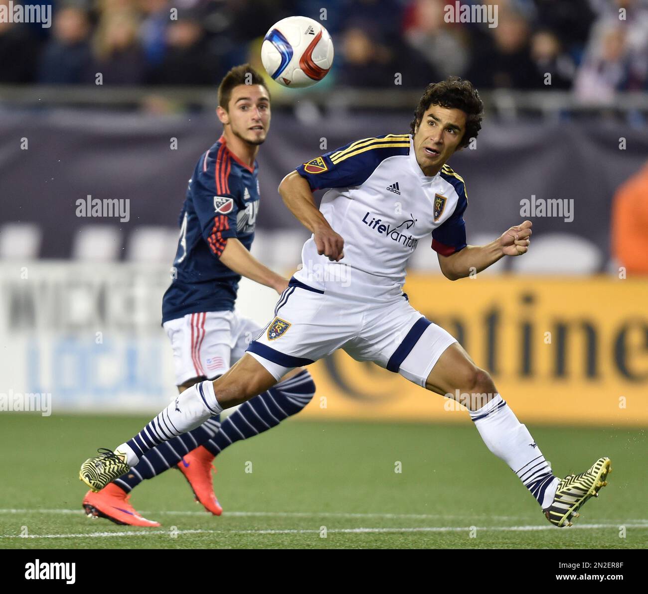 Real Salt Lake defender Tony Beltran, right, and New England Revolution