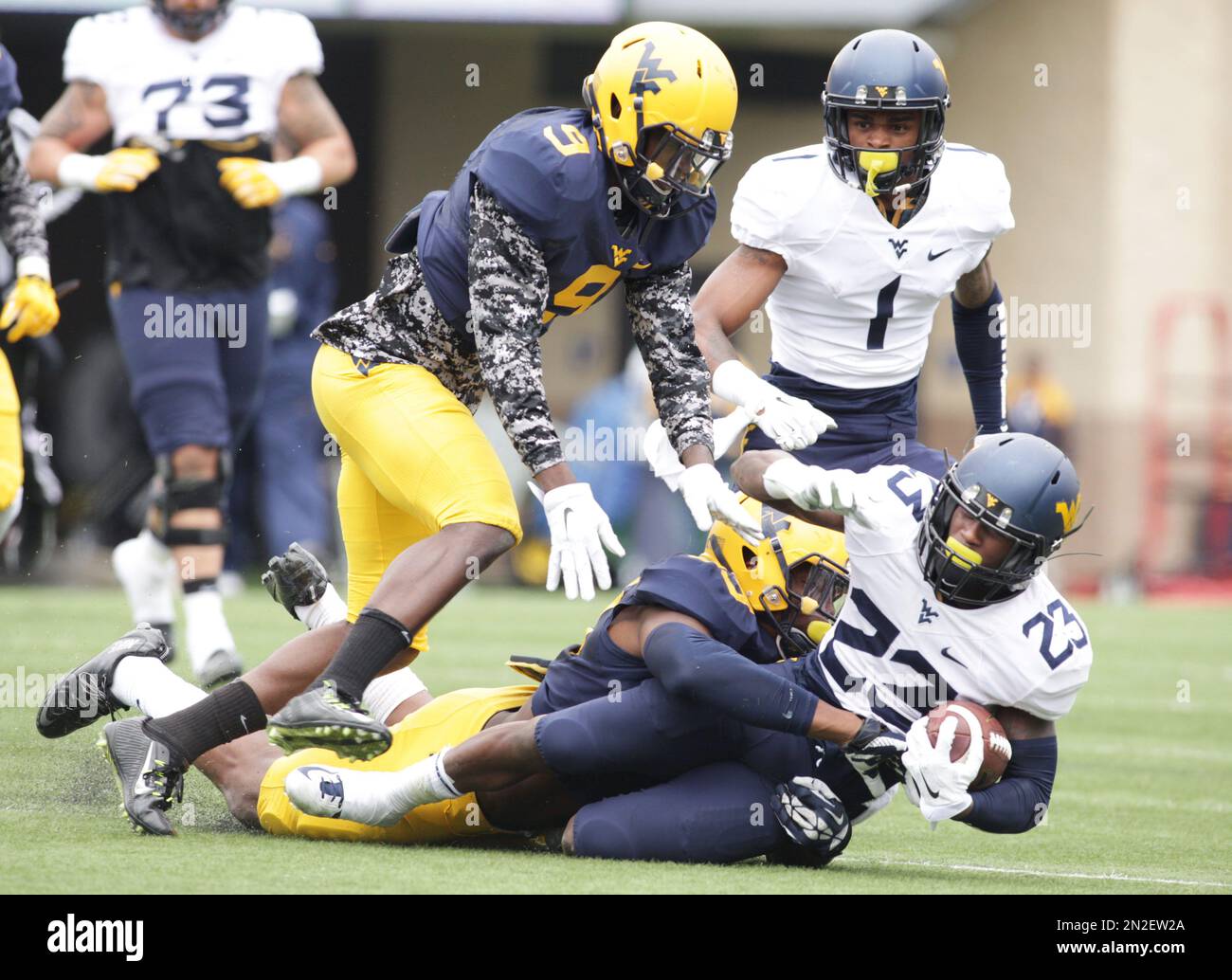 West Virginia linebacker Xavier Preston (53) and safety KJ Dillion (9