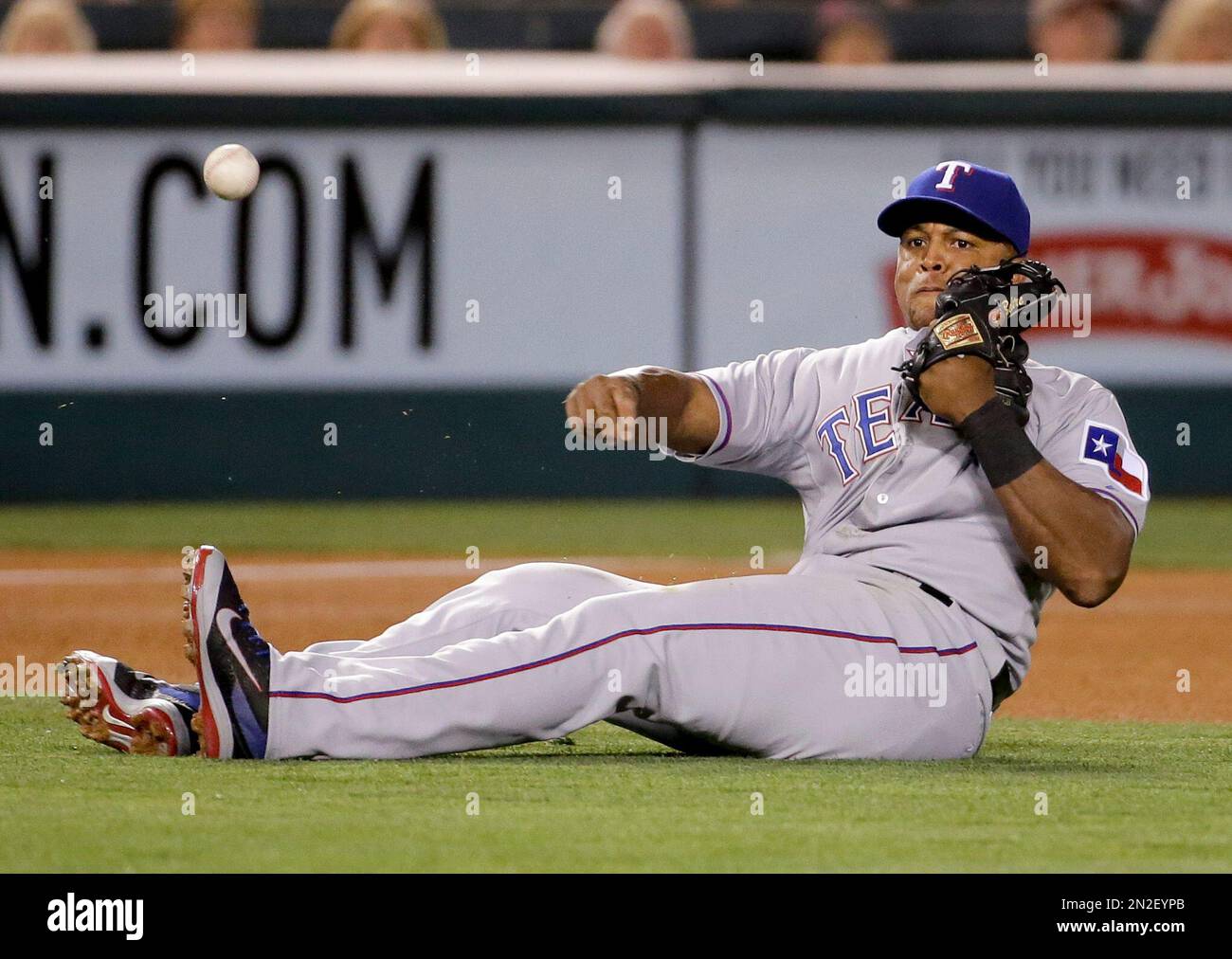 Texas Rangers third baseman Adrian Beltre fails to throw out Los Angeles Angels' Collin Cowgill at first during the fourth inning of a baseball game in Anaheim, Calif., Friday, April 24, 2015. (AP Photo/Chris Carlson) Stock Photo