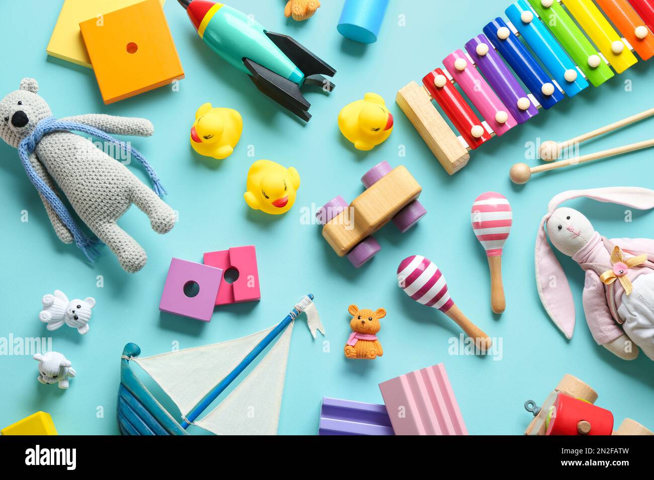 Flat lay composition with different toys on light blue background Stock Photo