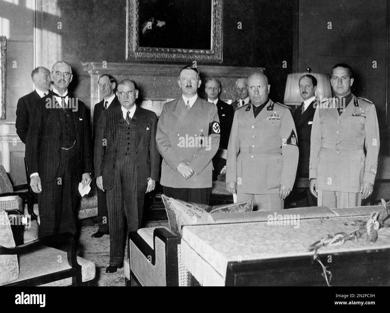 With European armies amassed and ready to fight, these power diplomats are shown at their historic Munich peace parley, Sept. 29, 1938, which ended the German-Czech crisis. From left: Neville Chamberlain, British prime minister; Edouard Baladier, French premier; Reichs-fuehrer Adolf Hitler; Italian leader Benito Mussolini; Count Galeazzo Ciano, Italian foreign minister. (AP Photo) Stock Photo