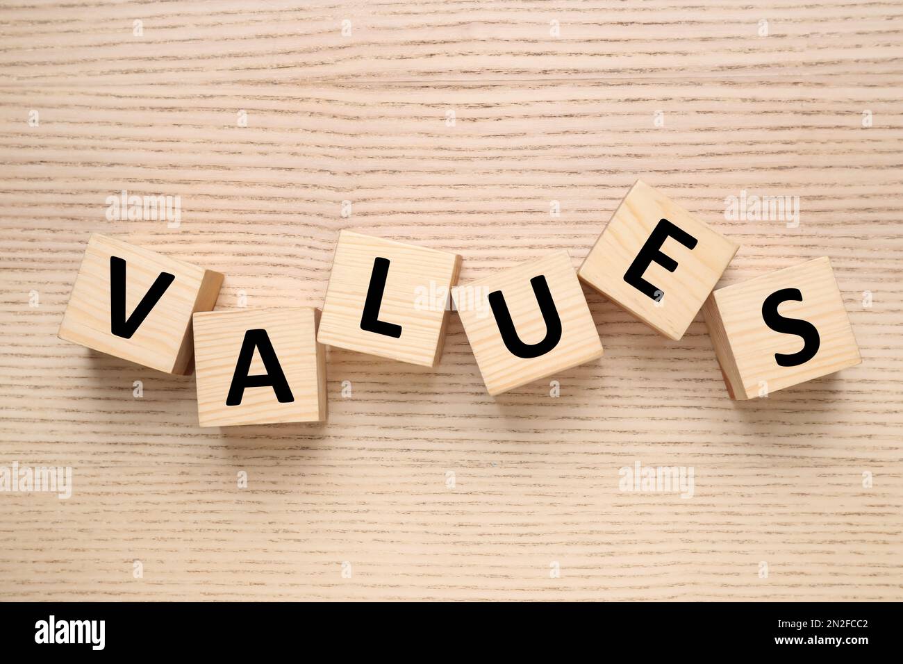 Cubes with word VALUES on wooden background, flat lay Stock Photo
