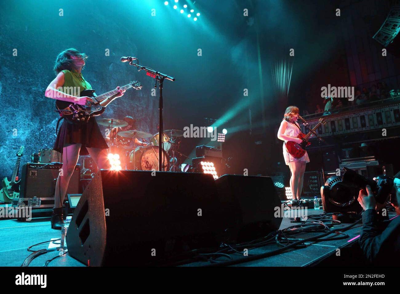Carrie Brownstein, Corin Tucker, and Janet Weiss performing with Sleater-Kinney