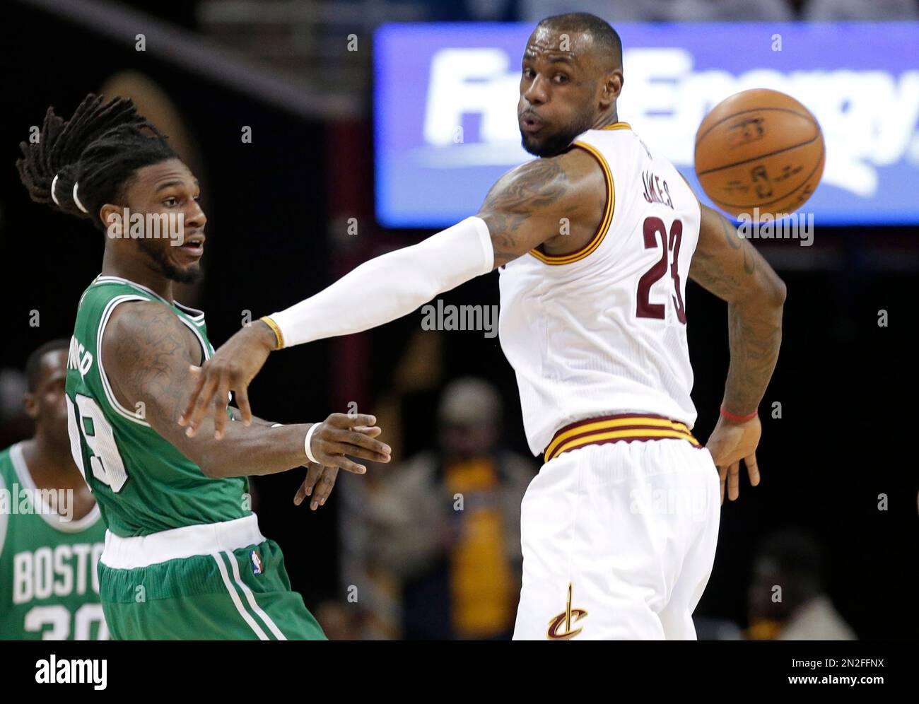 Boston Celtics’ Jae Crowder, left, passes around Cleveland Cavaliers