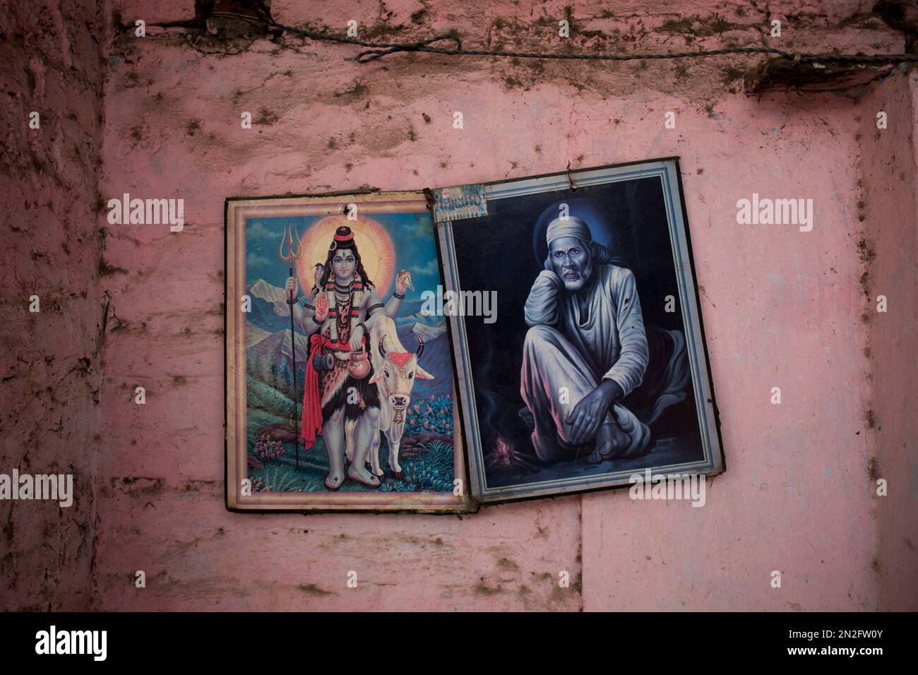 Portraits of Lord Shiva, the Hindu god of destruction, left, and Hindu ...