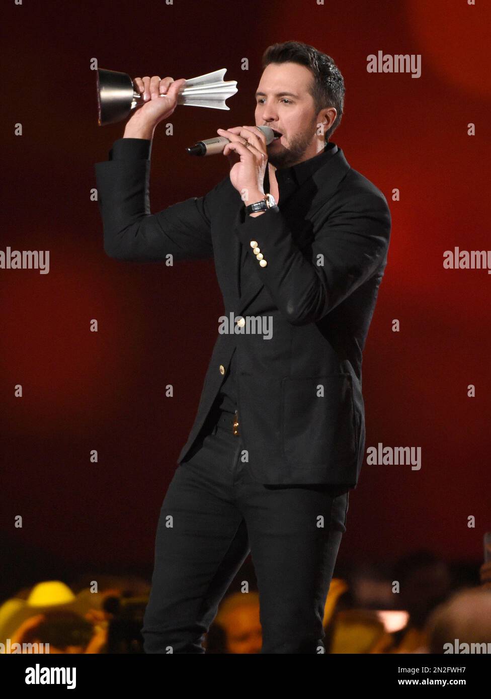 Luke Bryan accepts the award for entertainer of the year at the 50th