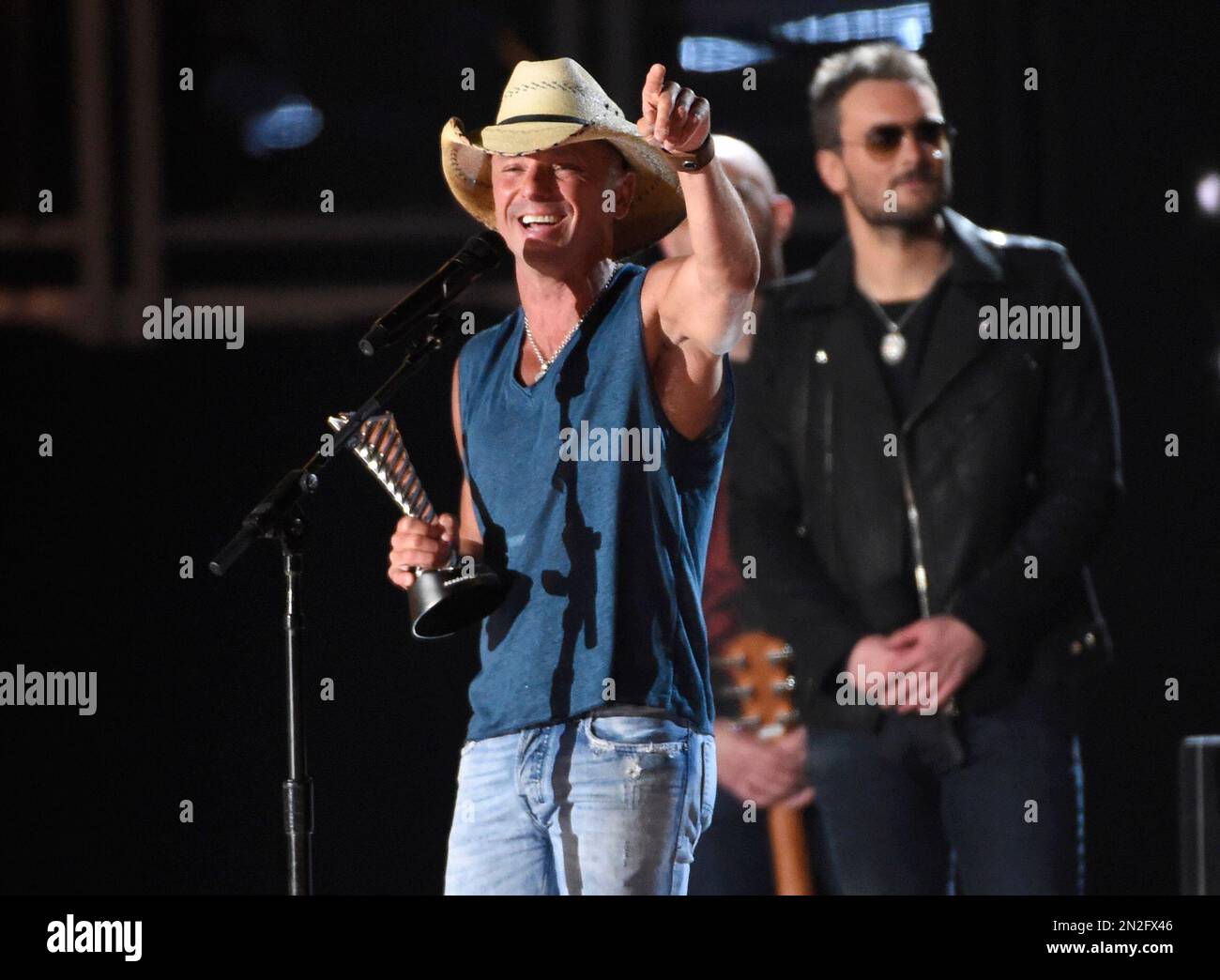 Kenny Chesney accepts the milestone award at the 50th annual Academy of(02)