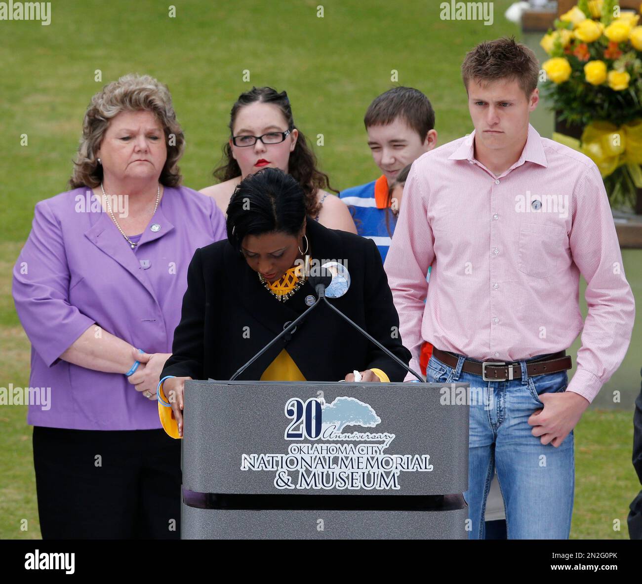 Helena Garrett, center, mother of bombing victim Tevin Garrett, breaks