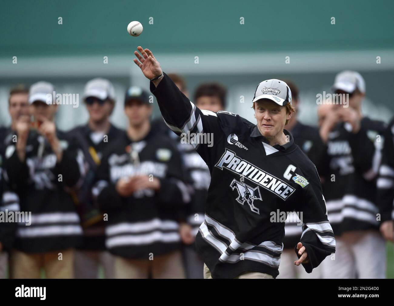 Ross Mauermann, captain of the National Championship Providence College Hockey team, throws out