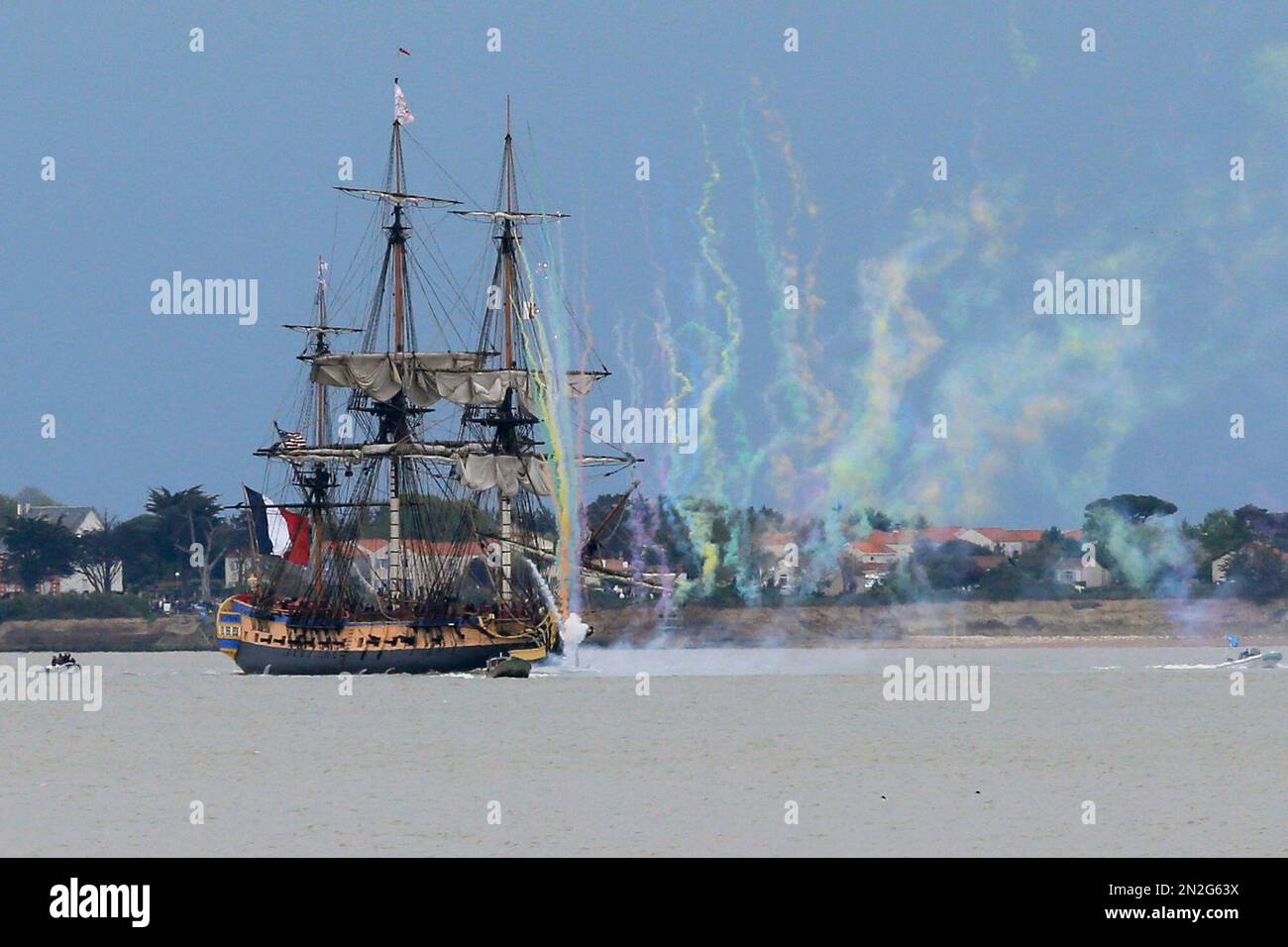 Fireworks crackle around the replica of the frigate Hermione, used to bring  French troops and funds to American revolutionaries in 1780, sails near  Fouras, southwest France, on his way for its transatlantic