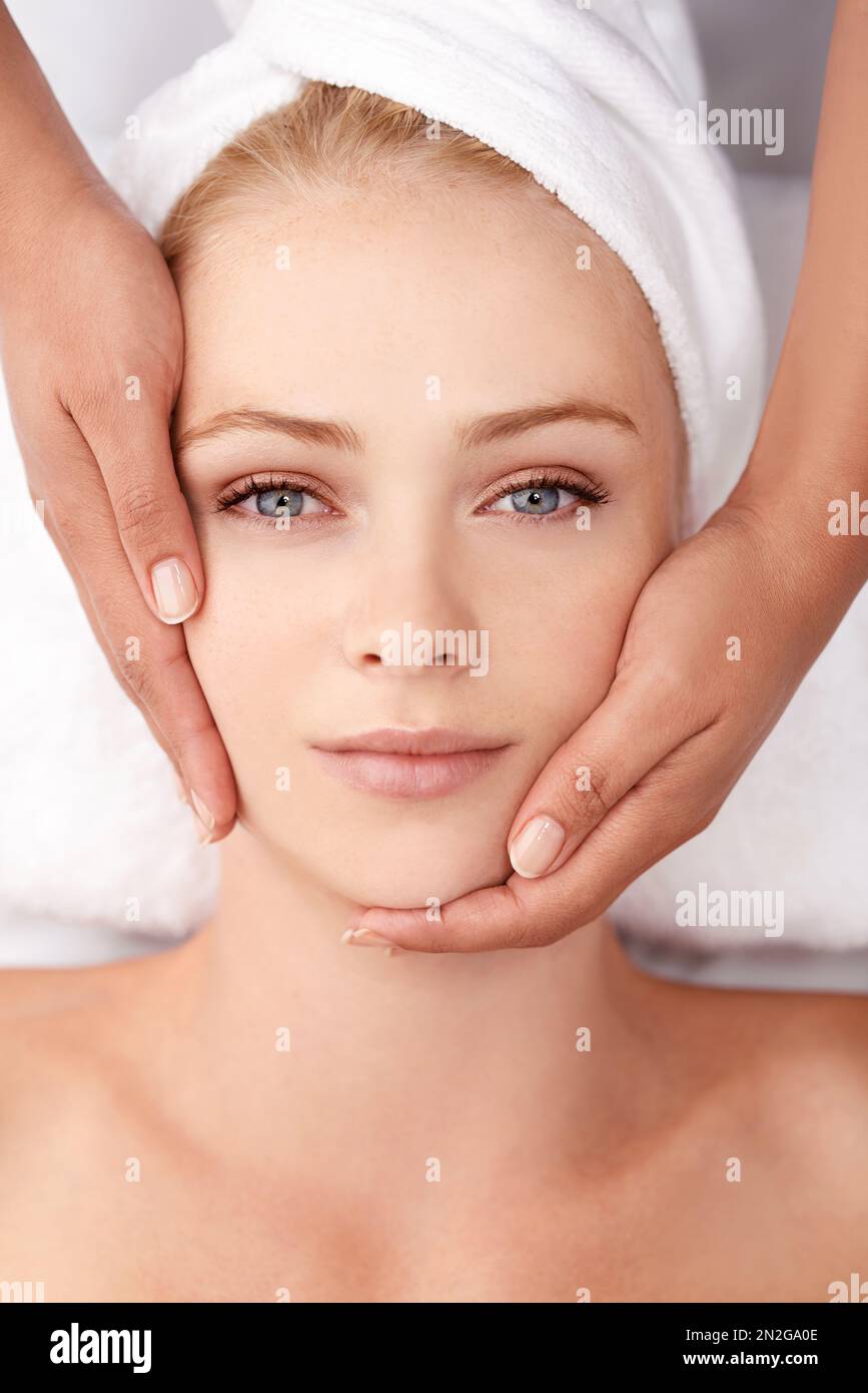 Total rejuvenation. A beautiful young woman enjoying a neck massage at
