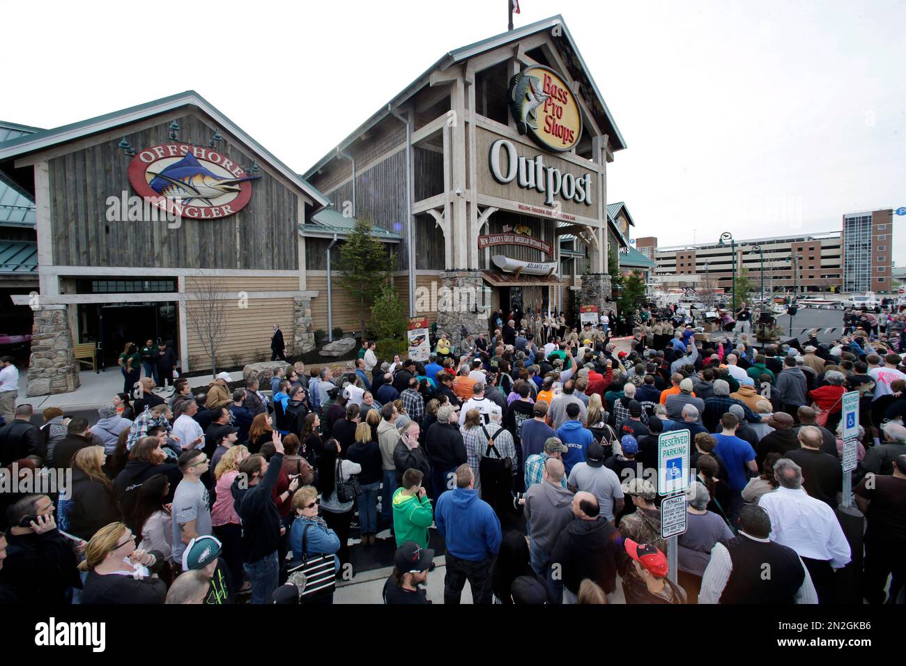 A large crowd of people line up as they wait for the grand opening of Bass  Pro Shops Outpost store Wednesday, April 15, 2015, in Atlantic City, N.J.  The city's efforts to