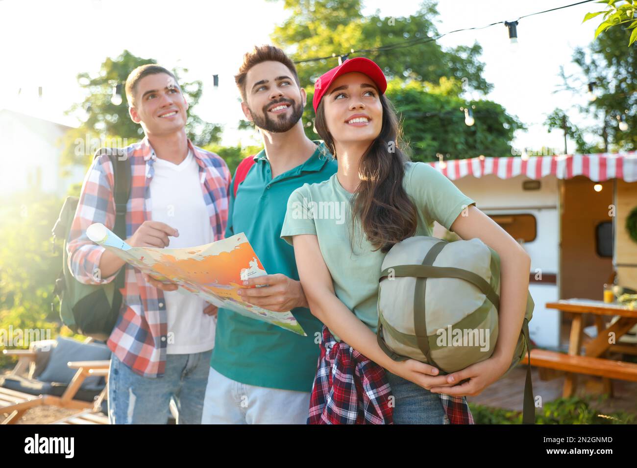 Young friends map planning hi-res stock photography and images - Alamy