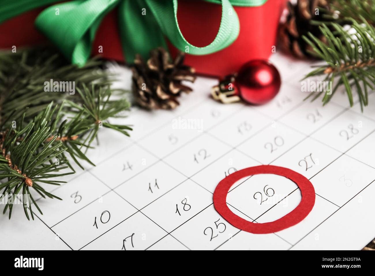 Calendar with marked Boxing Day date and fir branches, closeup Stock