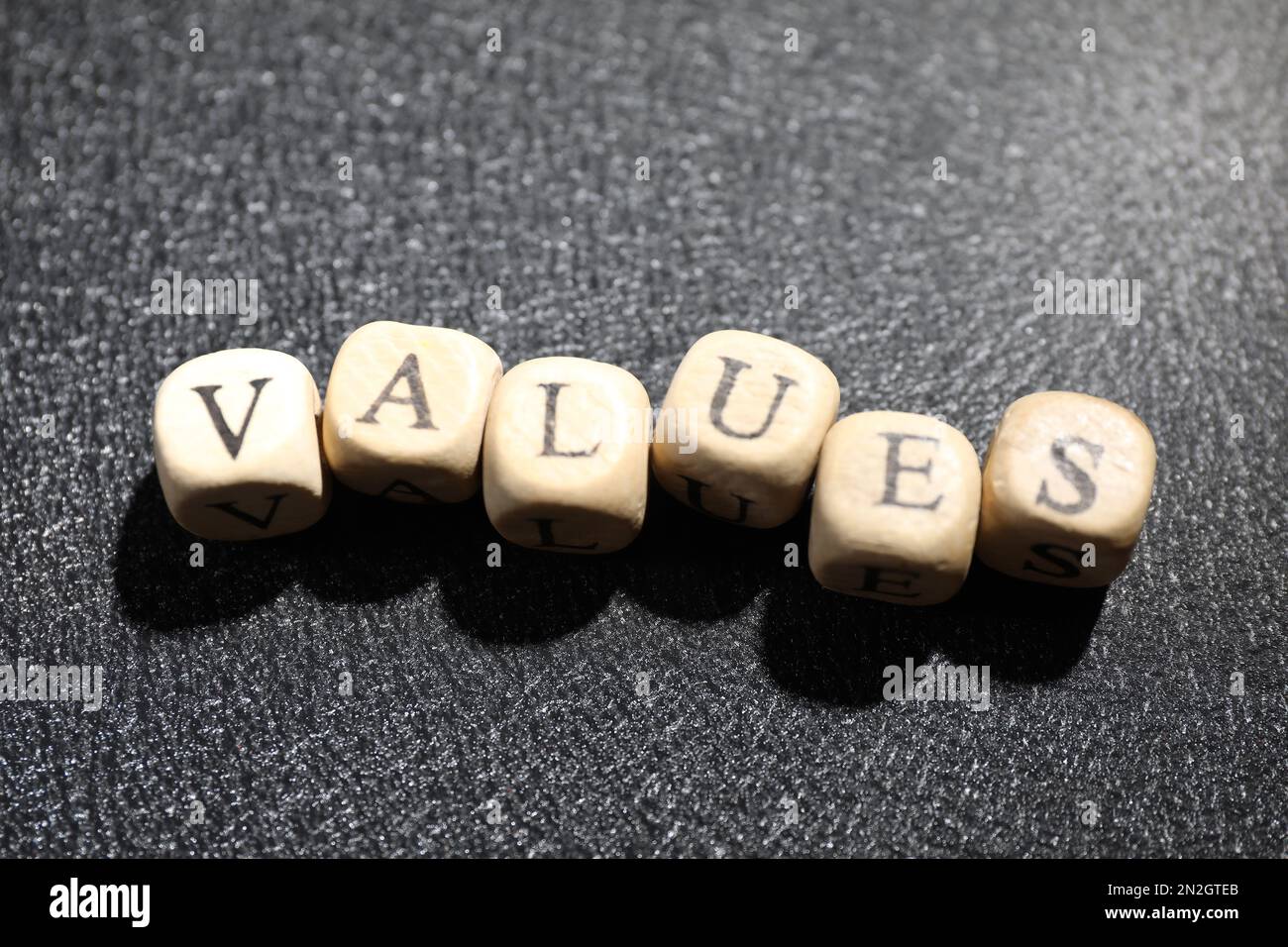 Beads with word VALUES on black background, above view Stock Photo - Alamy