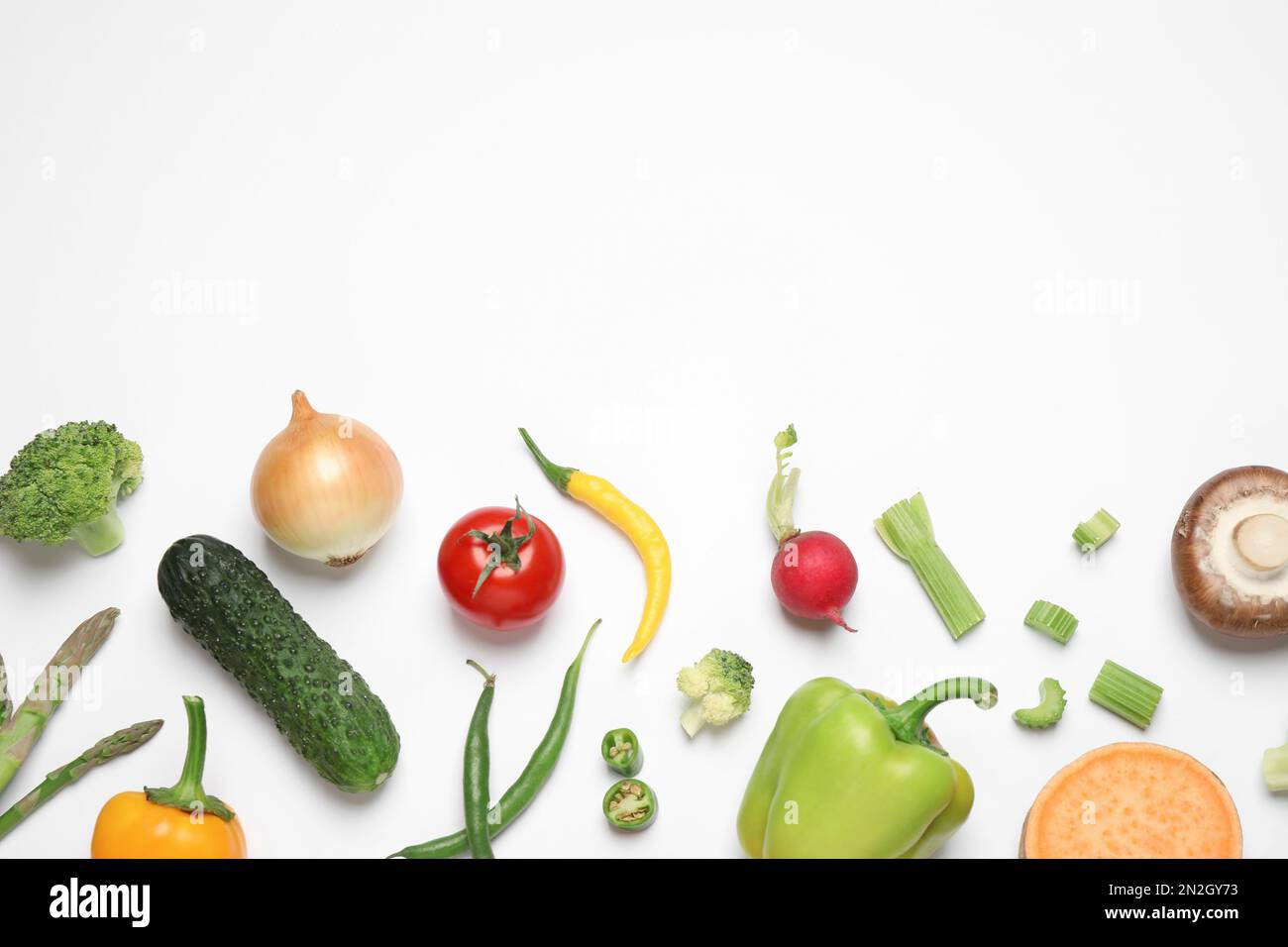 Flat lay composition with fresh vegetables on white background. Space ...