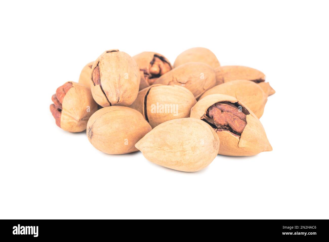 Bunch of inshell pecans on white background Stock Photo