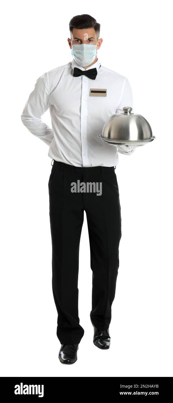 Waiter in medical face mask holding tray with lid on white background ...