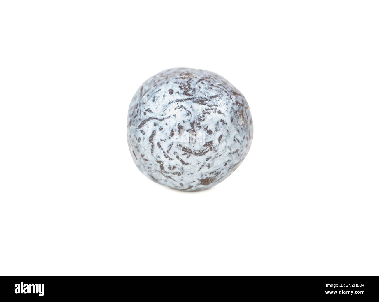 Round candy hazelnuts in chocolate isolated on white background Stock Photo