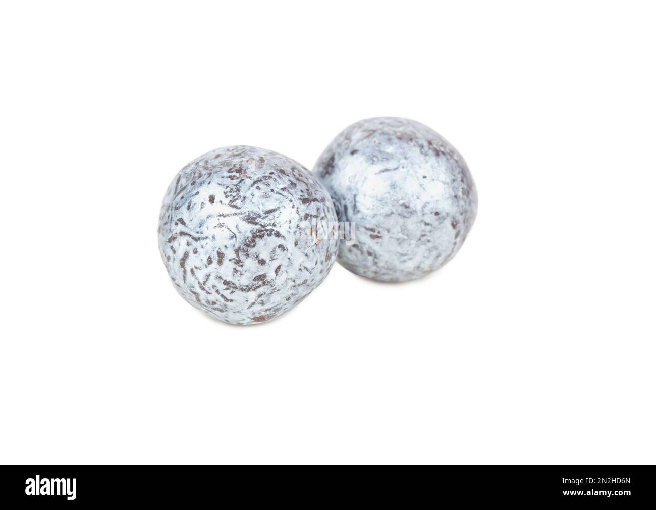 Two candy hazelnuts in chocolate isolated on white background Stock Photo