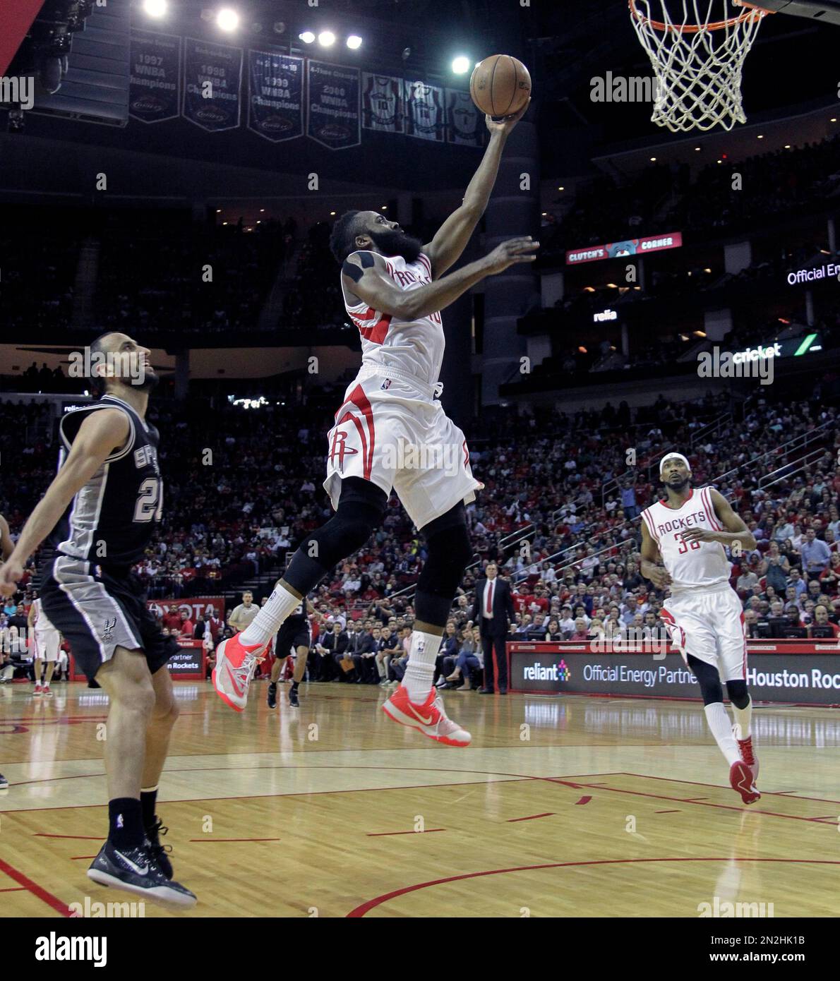 Houston Rockets guard James Harden (13) drives around San Antonio Spurs ...
