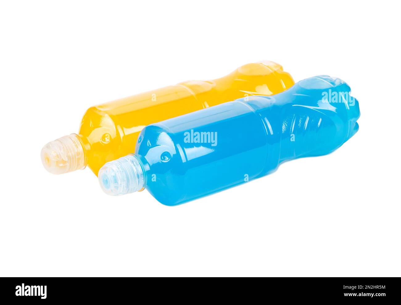Two lying bottles of Isotonic drink for sports in blue and orange on a white background. High quality photo Stock Photo