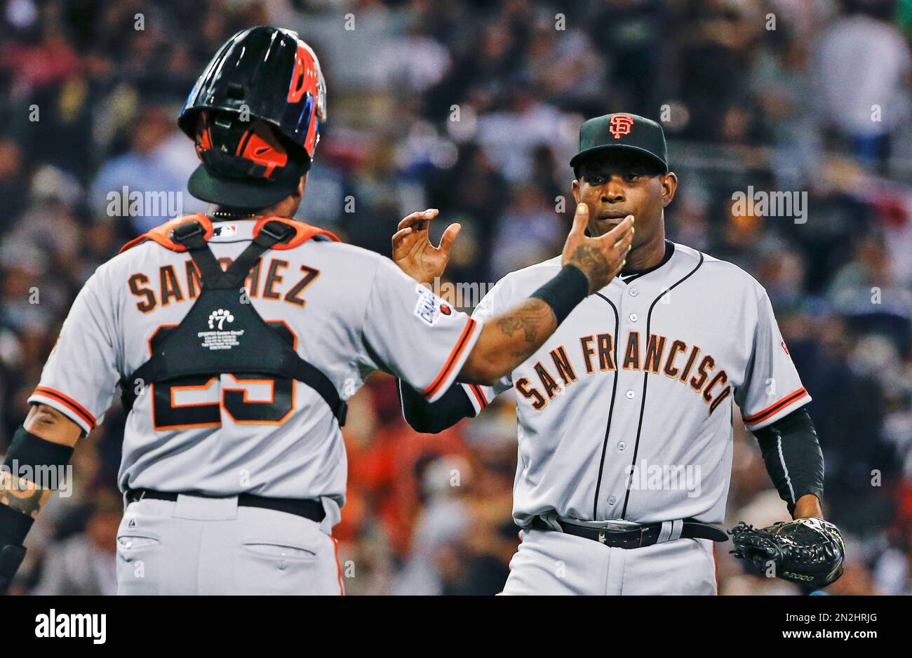 San Francisco Giants closer Santiago Casilla, right, is congratulated by  catcher Hector Sanchez after the Giants' 1-0 victory over the San Diego  Padres in 12 innings in a baseball game Thursday, April