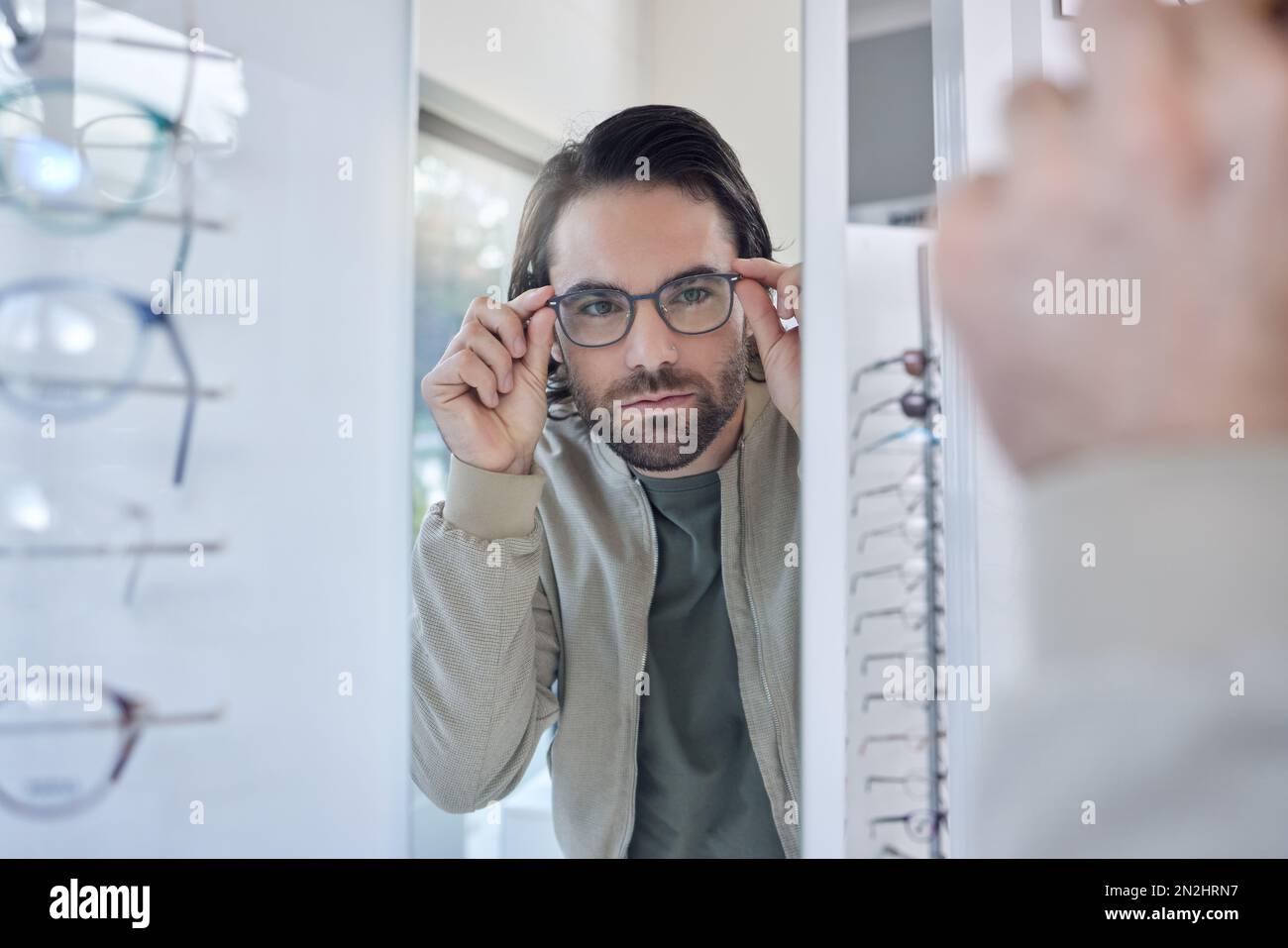 Optometry, glasses choice and man check mirror for vision, eye care and ...
