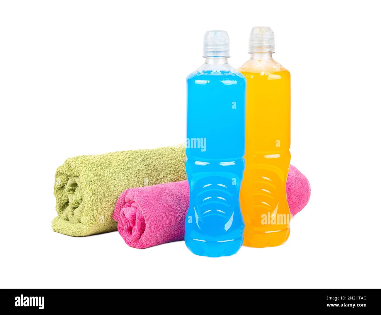 Plastic bottles with blue and orange isotonic drinks with two towels isolated on white background. Stock Photo