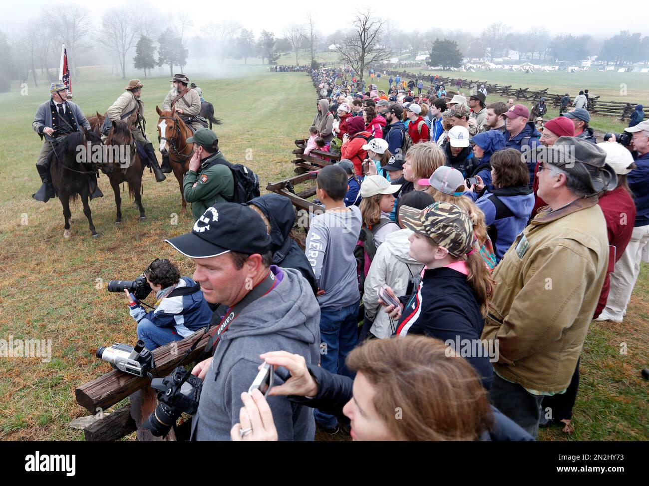 Confederate officers watch the battle along with visitors during a re ...