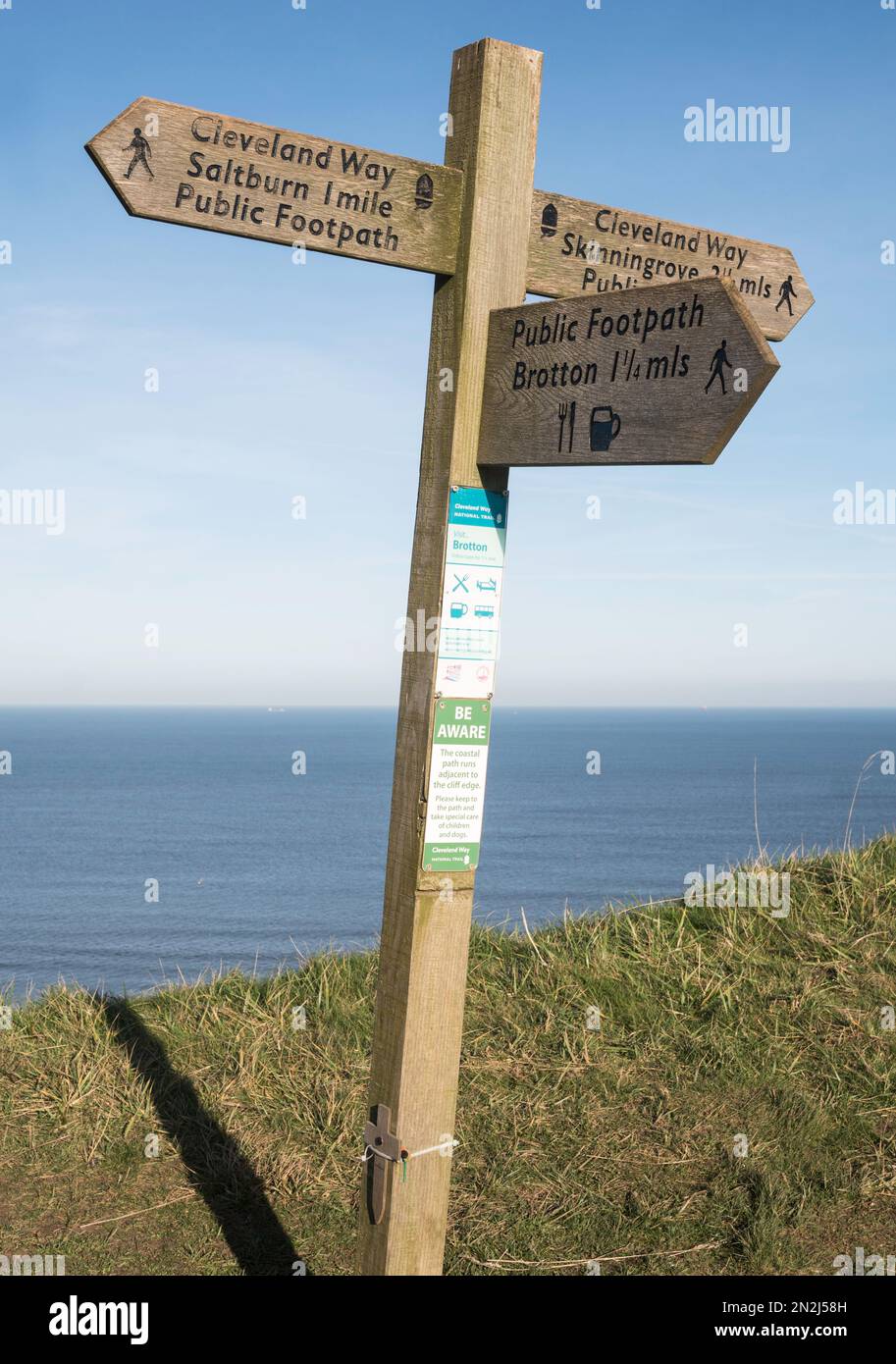 Wooden signpost on the Cleveland Way or England Coast path, near Saltburn, North Yorkshire, England, UK Stock Photo