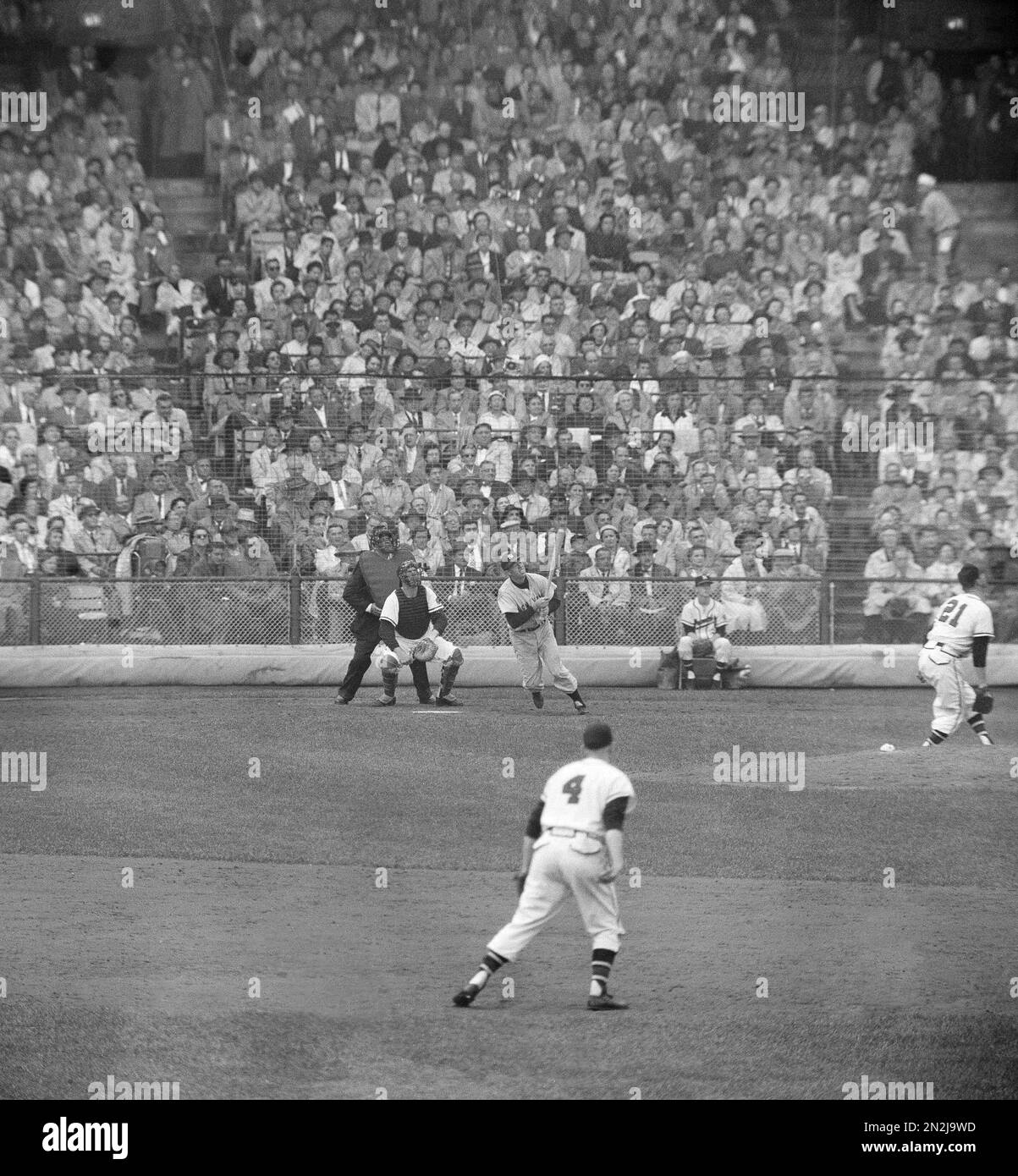 New York Yankees Gil McDougald hits a home run in the sixth game of the