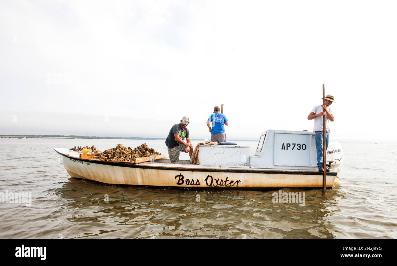 In this Thursday, April 2, 2015 photo, John Stokes, left, and his two
