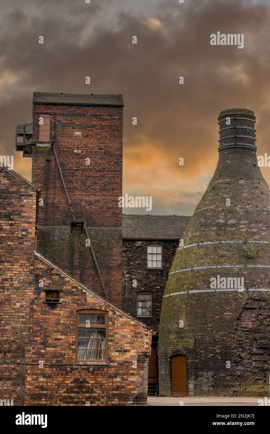Stoke On Trent, Staffordshire. Bottle Kilns and chimneys at Middleport pottery dramatic sunset lighting. 5 towns potteries. Stock Photo