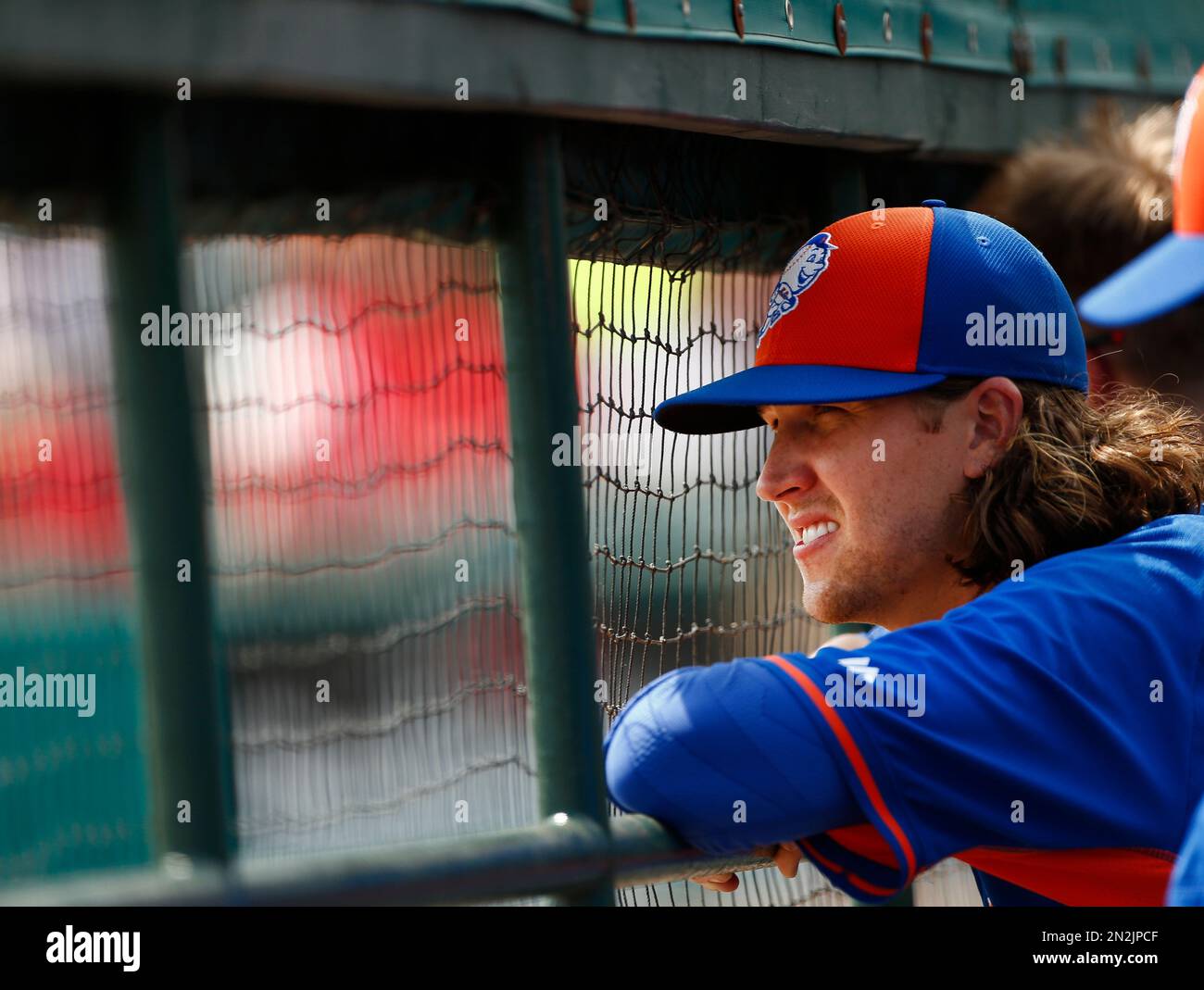 New York Mets starting pitcher Jacob deGrom looks out from the dugout