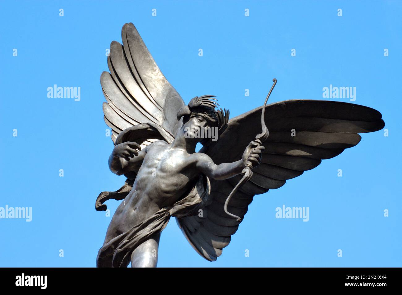 A low angle view of the familiar statue of Eros in Piccadilly Circus