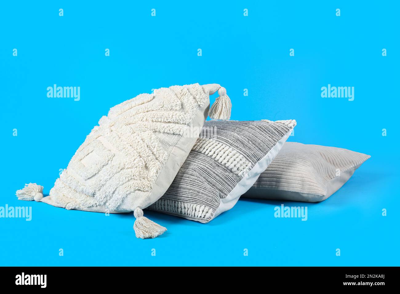 Set of decorative pillows on blue background Stock Photo