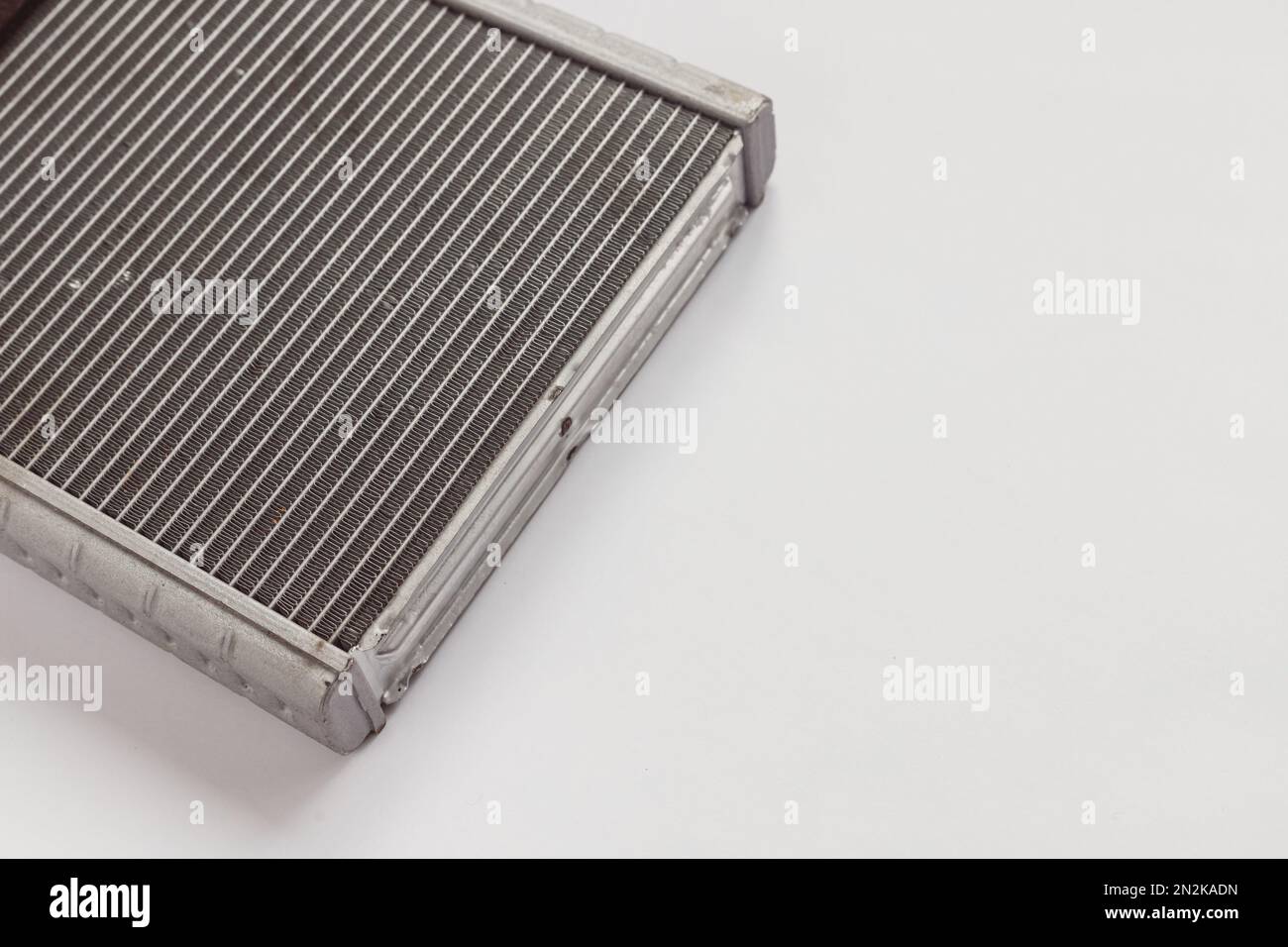 Car aluminum Heat Exchanger. Air Heater radiator for vehicle on white background. Industrial parts. Stock Photo
