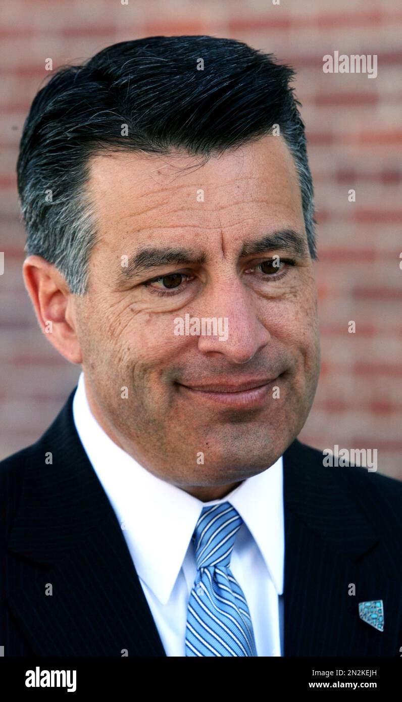 Nevada Governor Brian Sandoval stands on the front steps of the