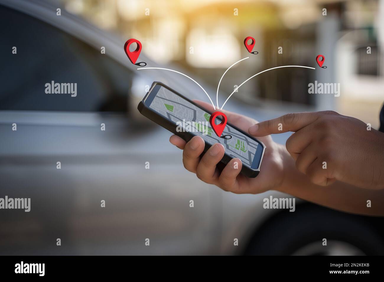 A man makes use of GPS and the internet. online map in the car controls ...