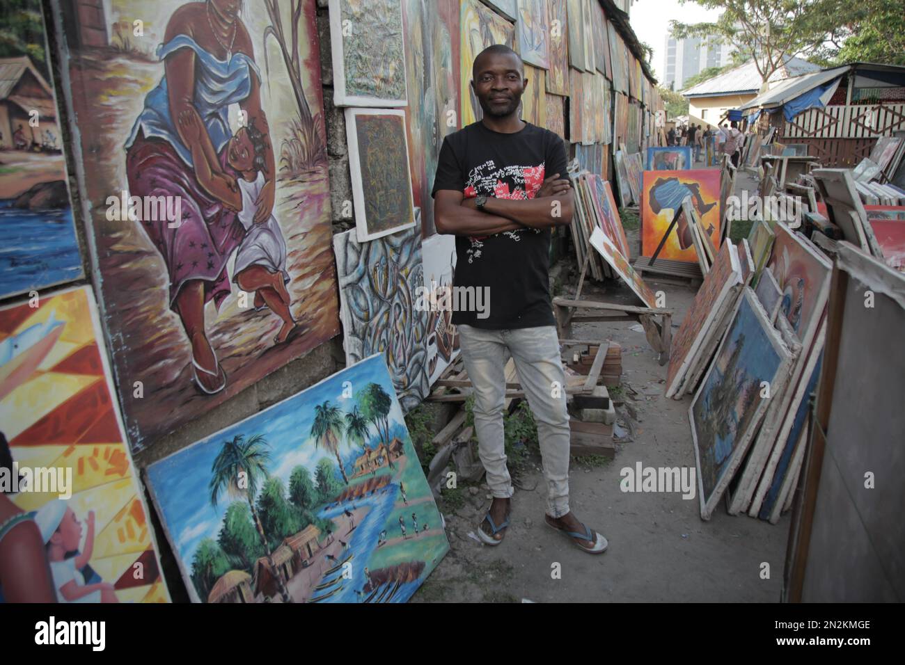 Congolese artist visiting his posters in Kinshasa Stock Photo Alamy