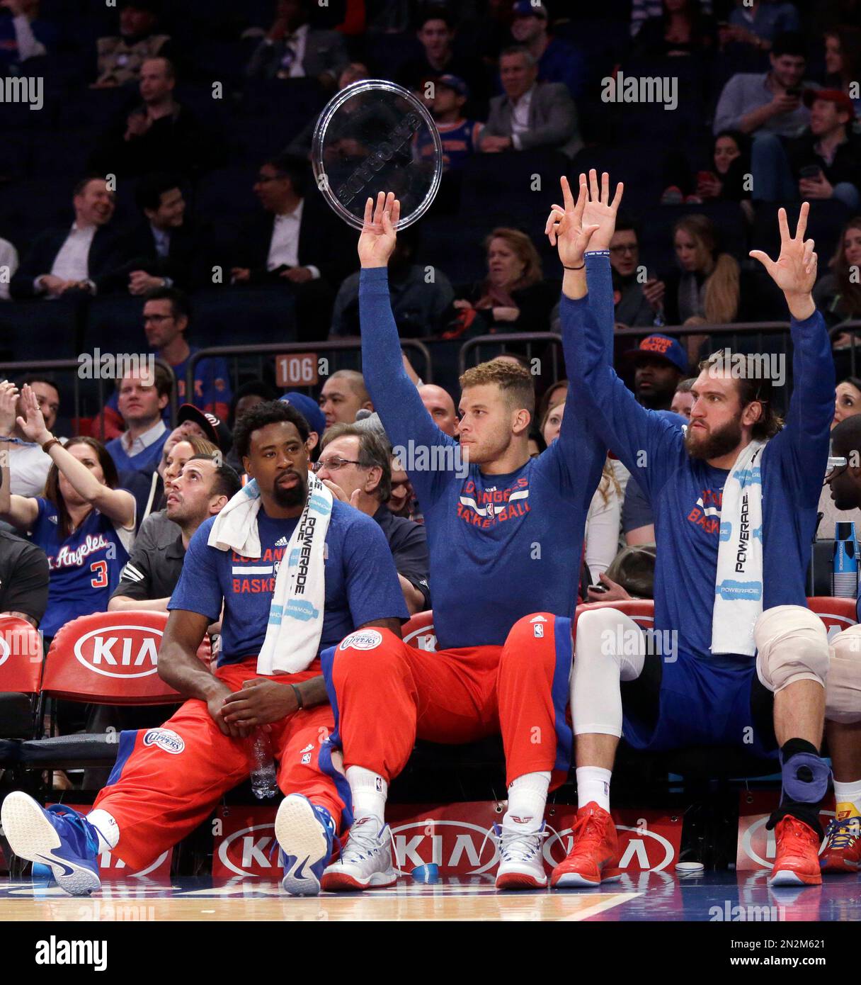 Los Angeles Clippers center DeAndre Jordan, left, forward Blake Griffin,  center, and Spencer Hawes react after a teammate scored a 3-point goal  during the second half of an NBA basketball game against