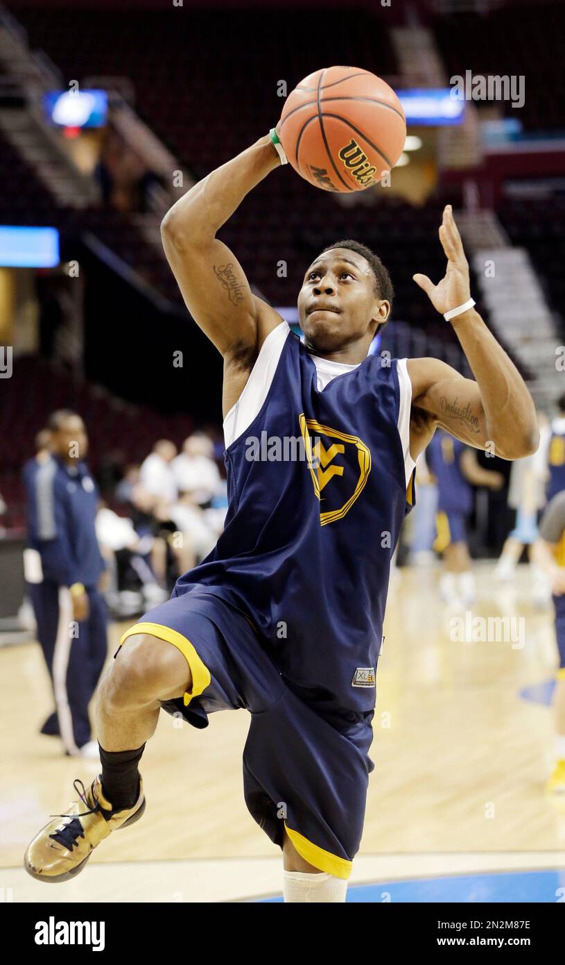 West Virginia's Juwan Staten goes up for a shot during practice for a