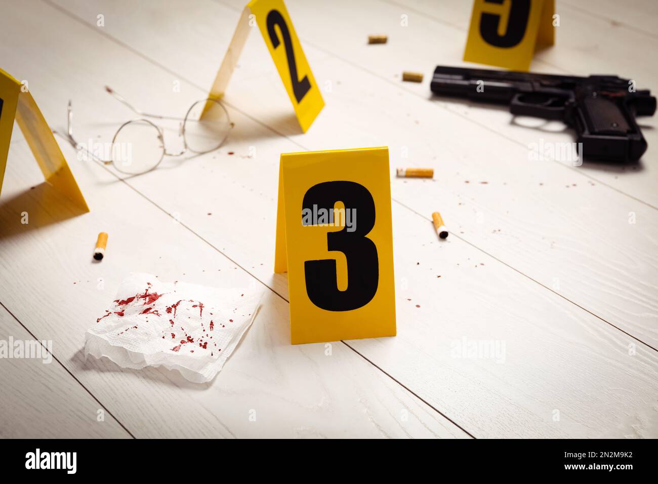 Evidences and crime scene marker on white wooden table Stock Photo - Alamy