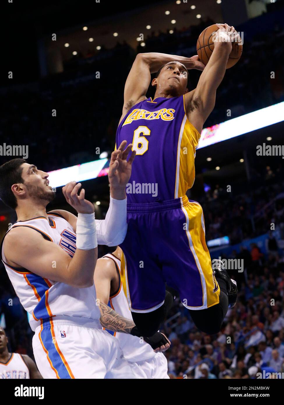 Los Angeles Lakers guard Jordan Clarkson (6) goes up for a dunk in front of  Oklahoma City Thunder center Enes Kanter during the second quarter of an  NBA basketball game in Oklahoma